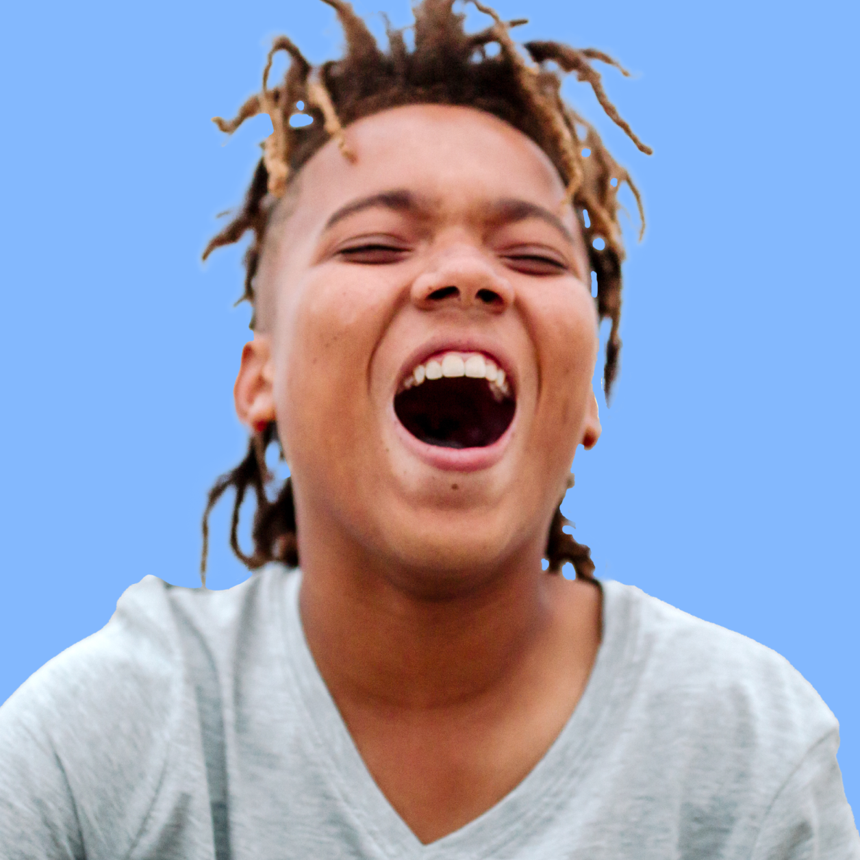 Teen boy open mouth laughing