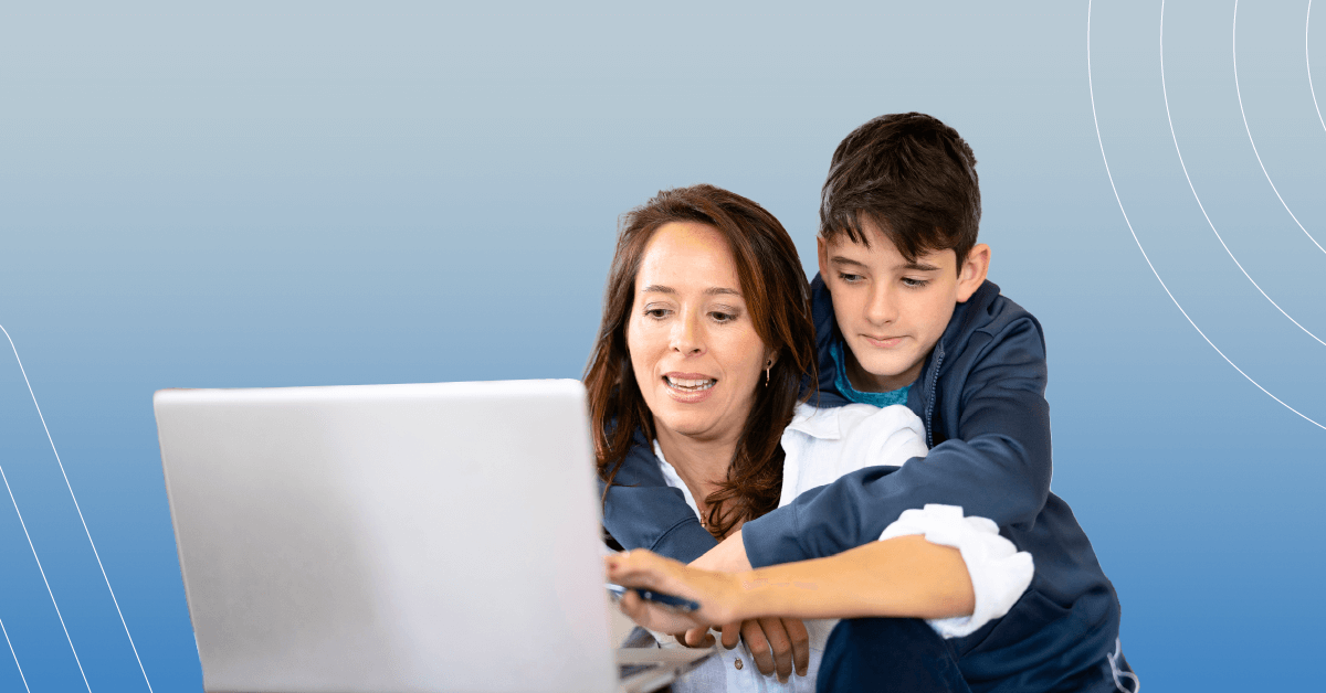 mom and son looking at laptop